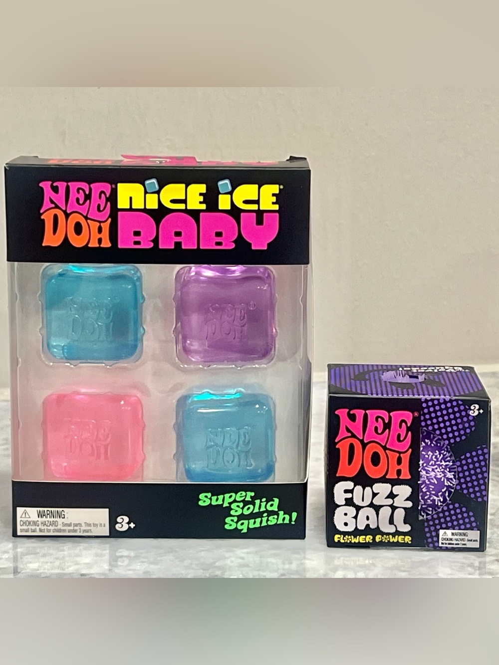 Sold! 
NeeDoh Nice Ice Baby & NeeDoh Fuzz Ball Squishy Toy - Purple